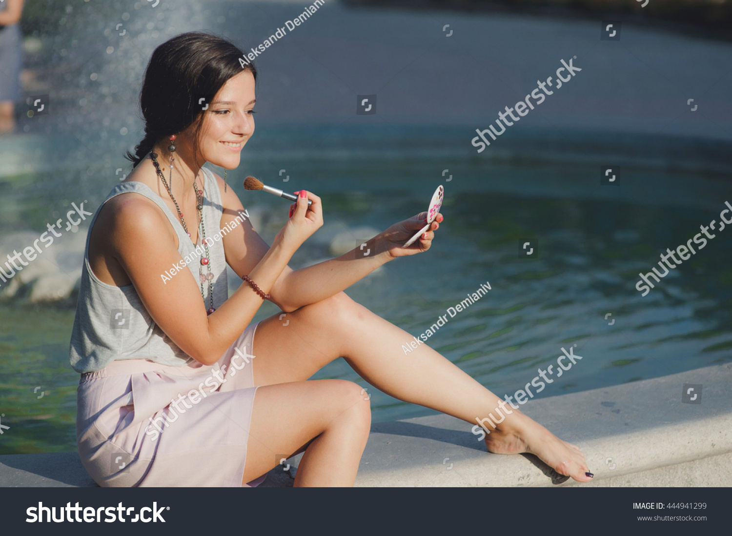 https://image.shutterstock.com/z/stock-photo-sun-burnt-girl-corrects-her-make-up-and-looking-at-the-mirror-444941299.jpg