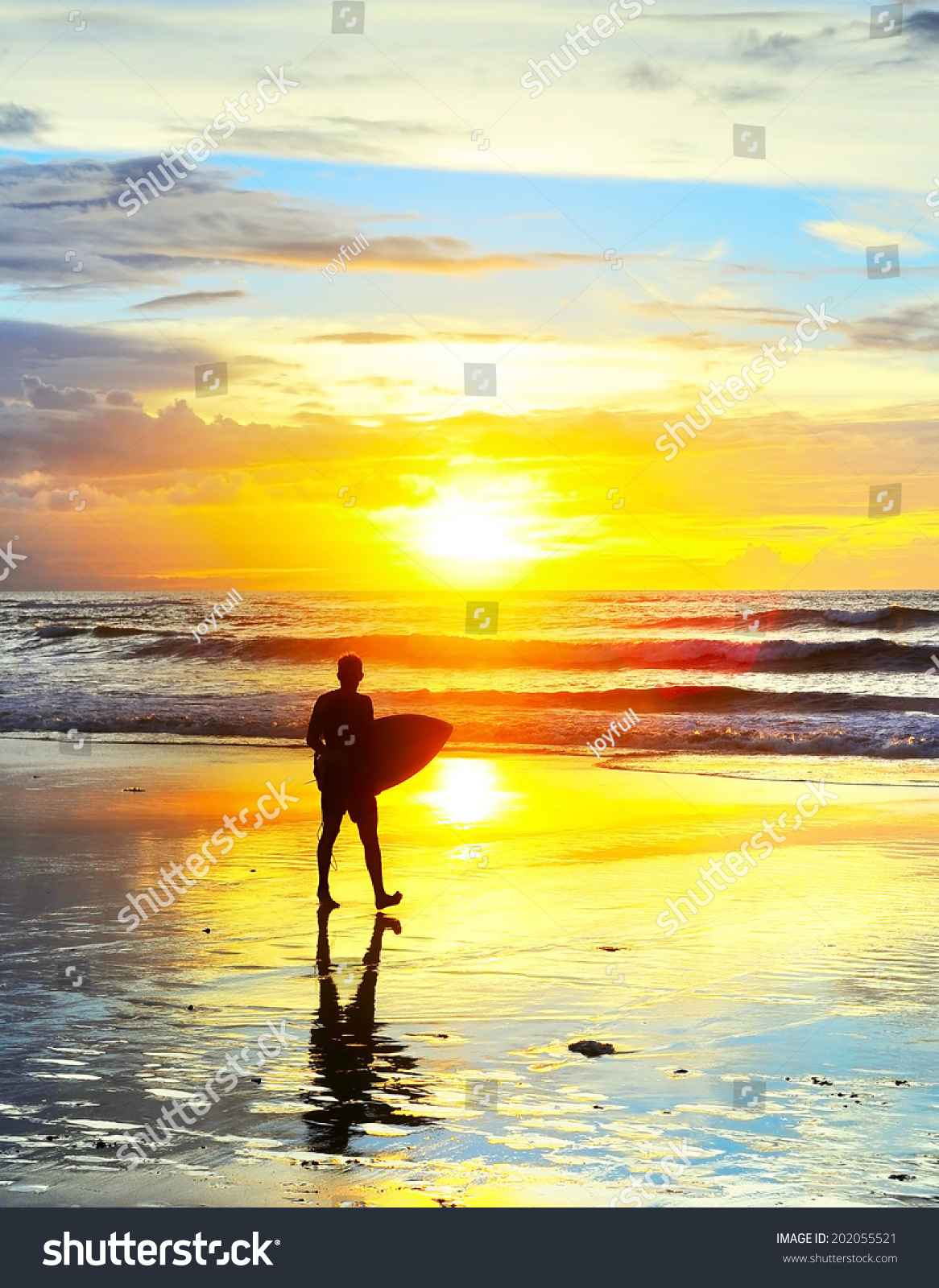 Surfer Walking With Surfboard On The Ocean Beach At Sunset. Bali Island ...