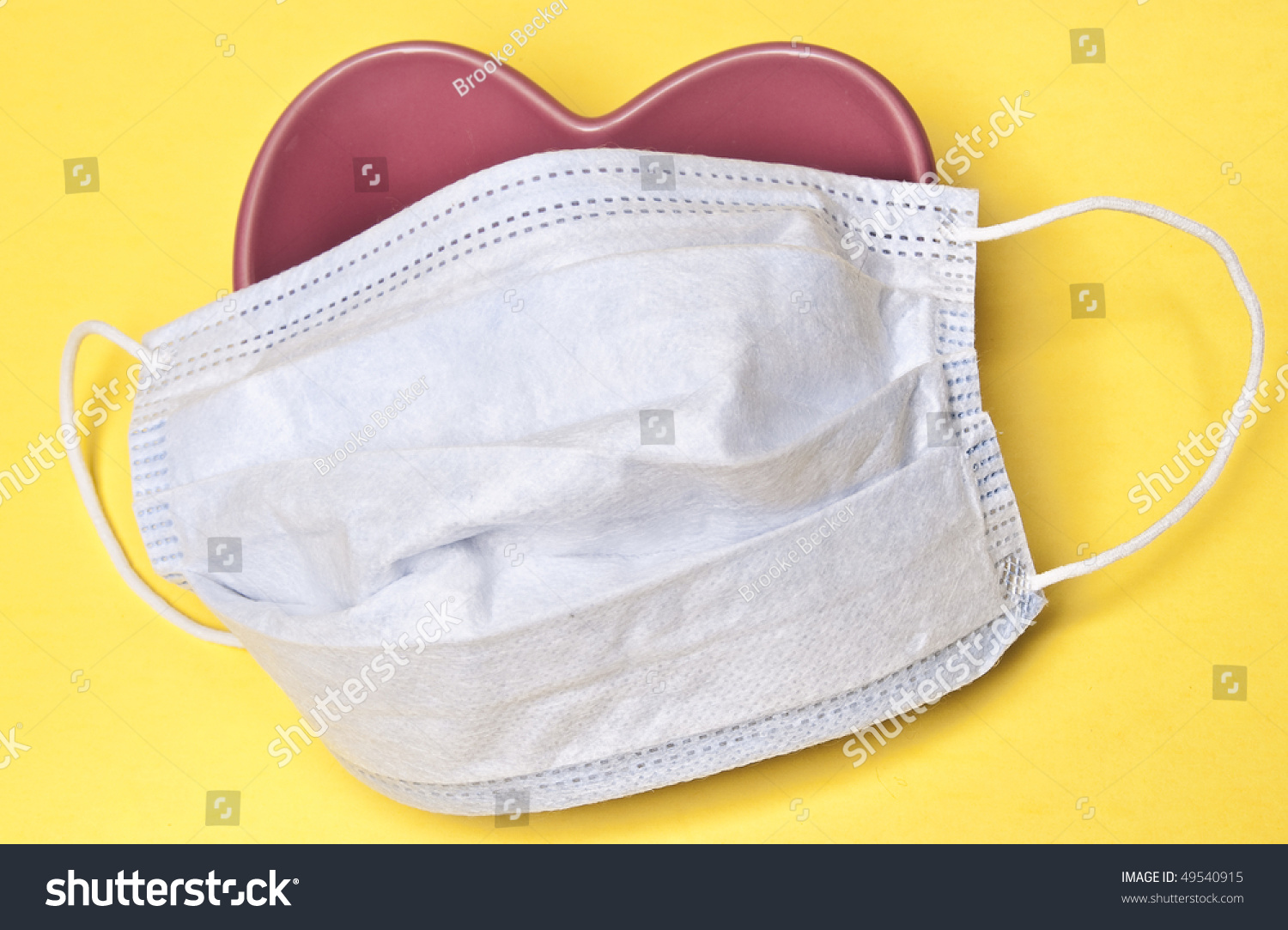 Download Surgical Mask Over Heart On Yellow Stock Photo Edit Now 49540915 PSD Mockup Templates