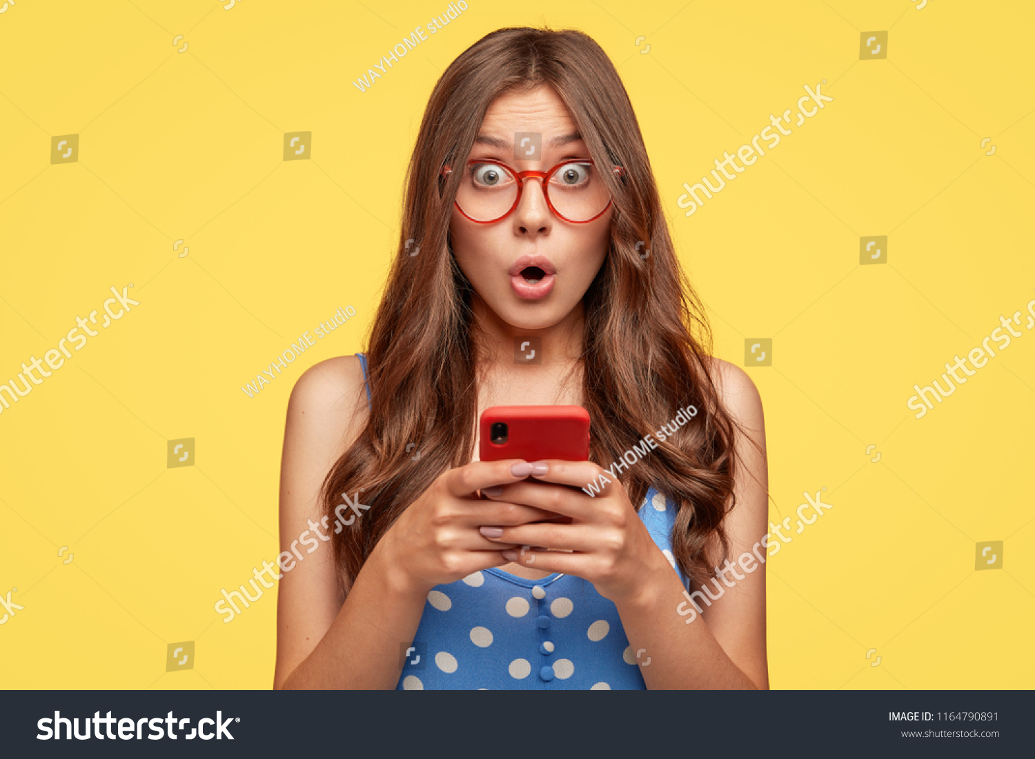 Surprised Young Female Model Holds Modern Stock Photo Edit Now