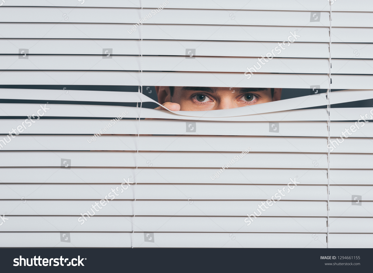 Suspicious Young Man Peeking Looking Camera Stock Photo 1294661155 ...