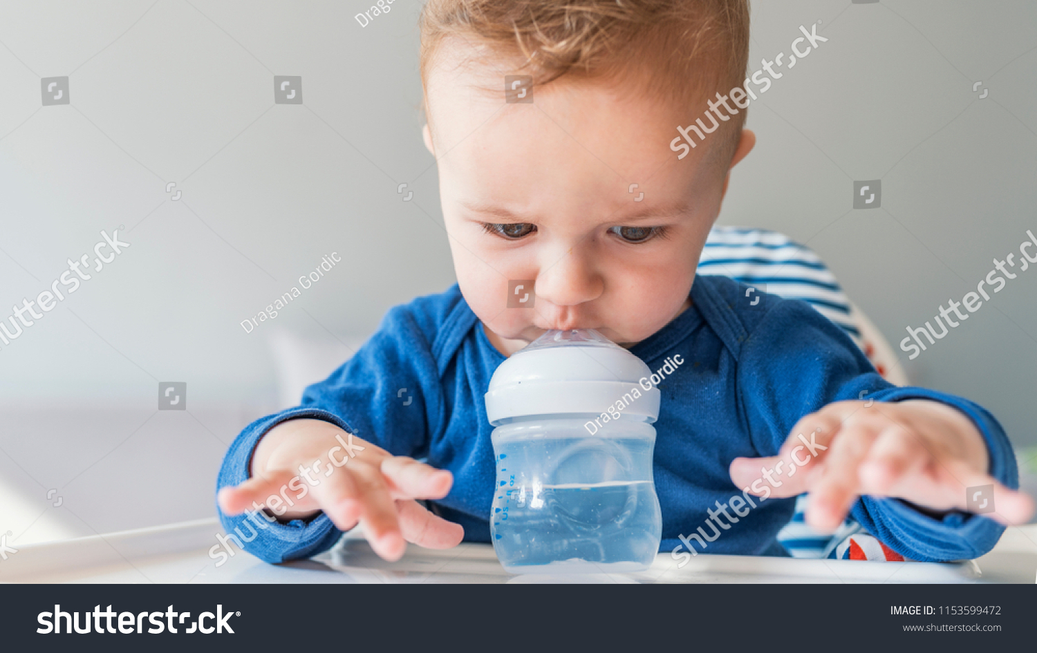 Sweet Baby Boy Holding Bottle Drinking Stock Photo 1153599472 ...