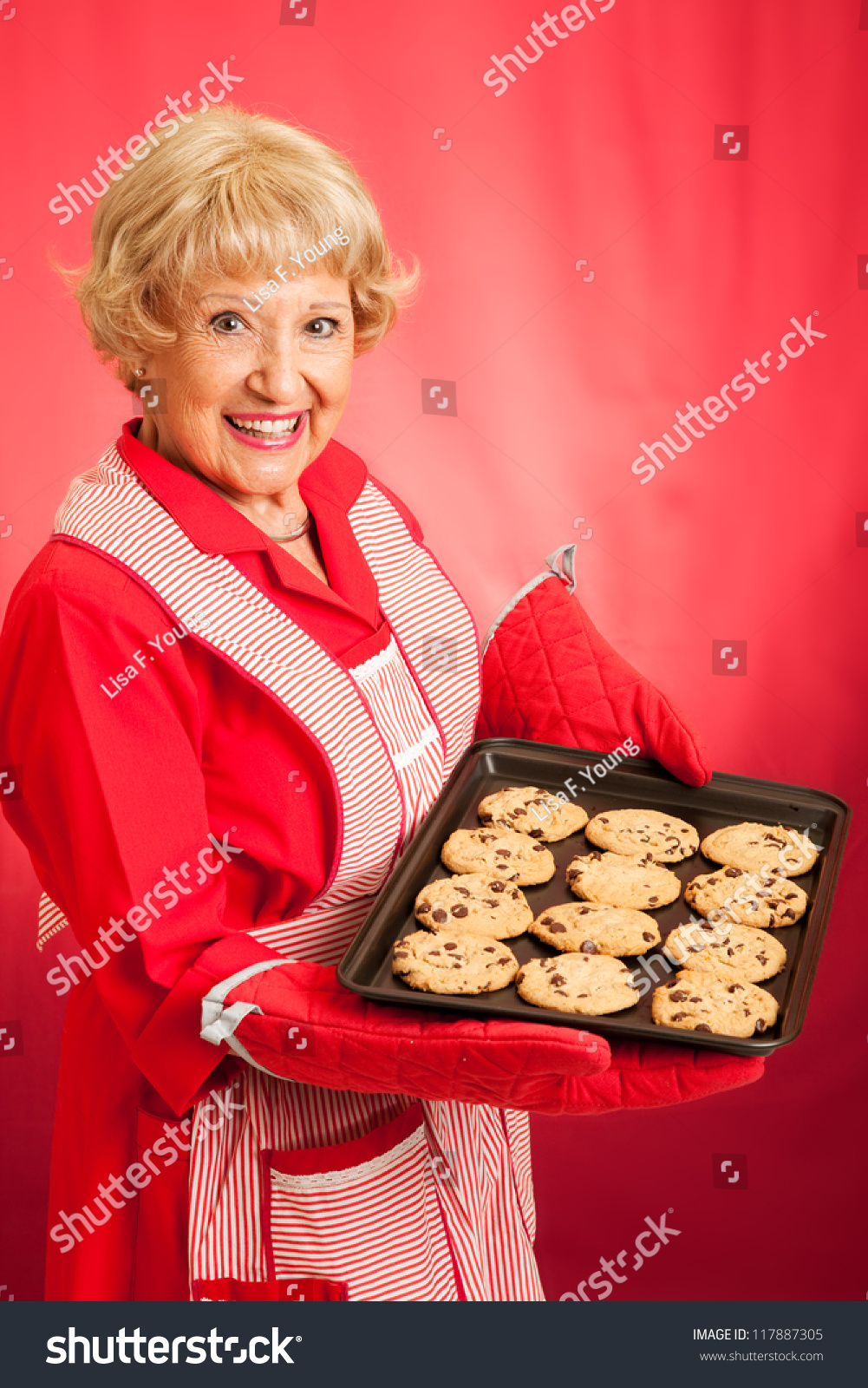 Sweet Homemaker Grandma Holding A Tray Of Fresh Baked Chocolate Chip ...