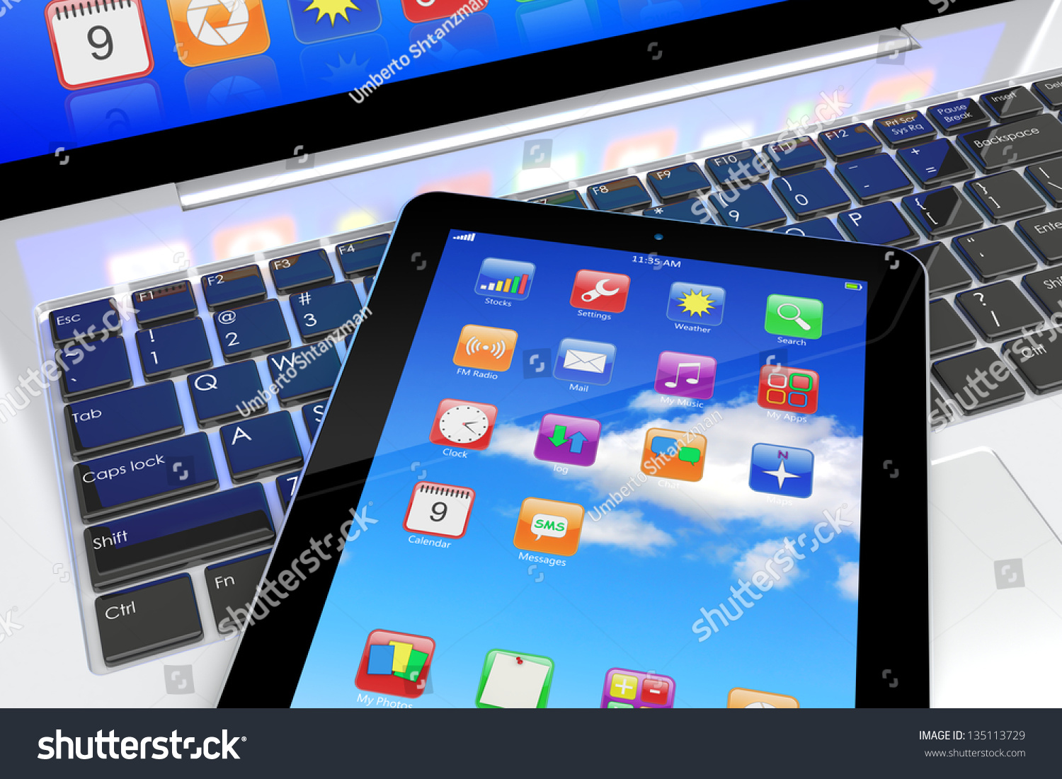 Tablet Pc With Colorful Apps On A Screen Lying On Laptop Keyboard