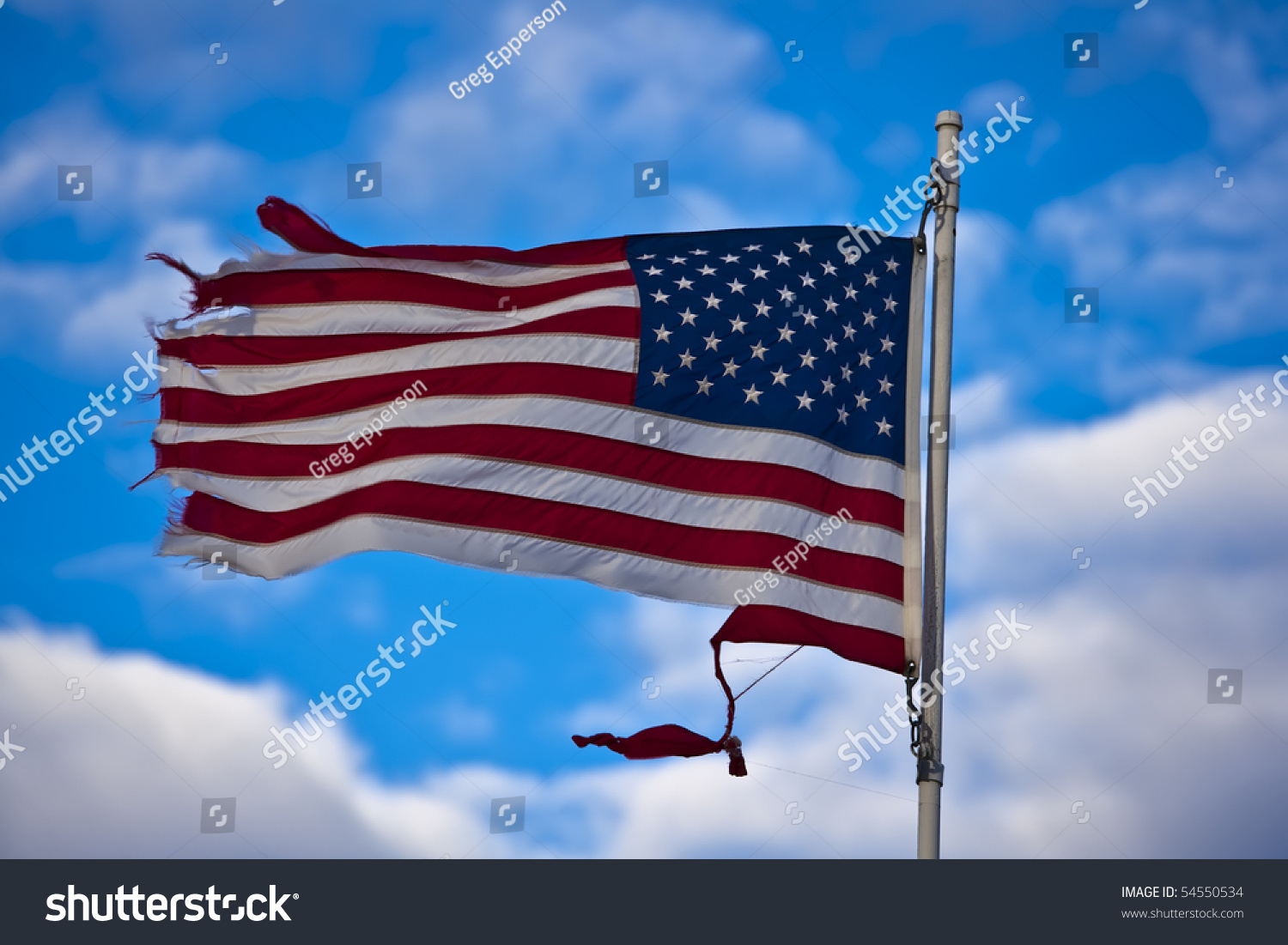 Tattered Usa Flag Blowing In The Breeze. Stock Photo 54550534 ...