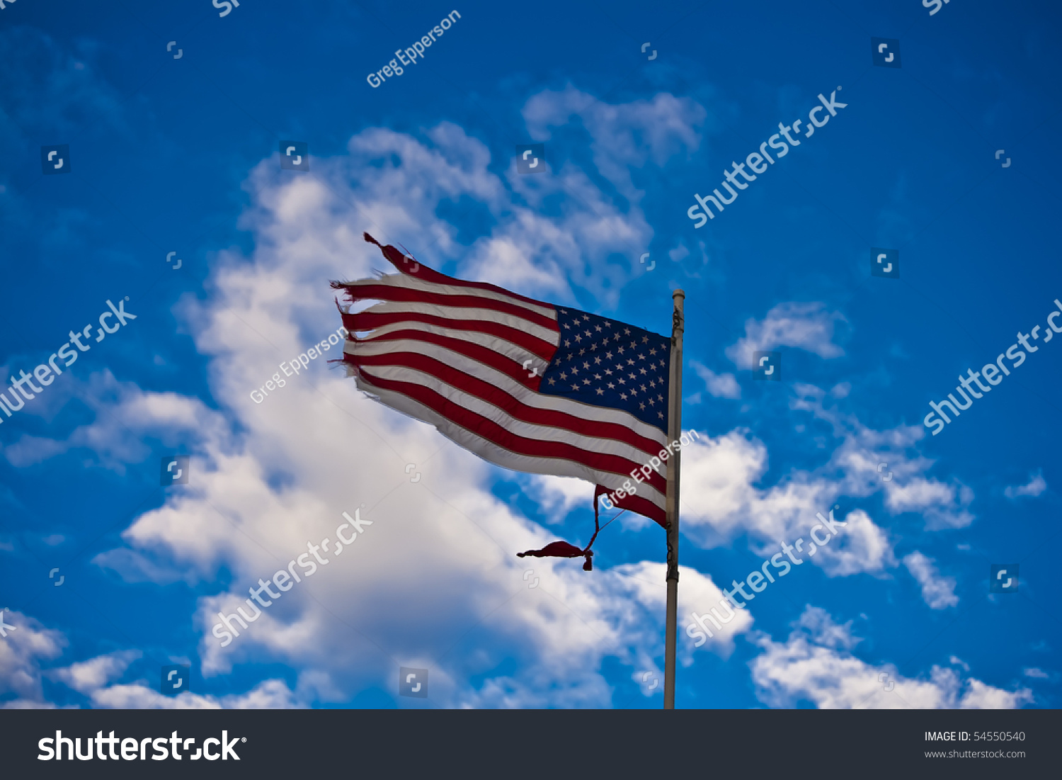 Tattered Usa Flag Blowing In The Breeze. Stock Photo 54550540 ...