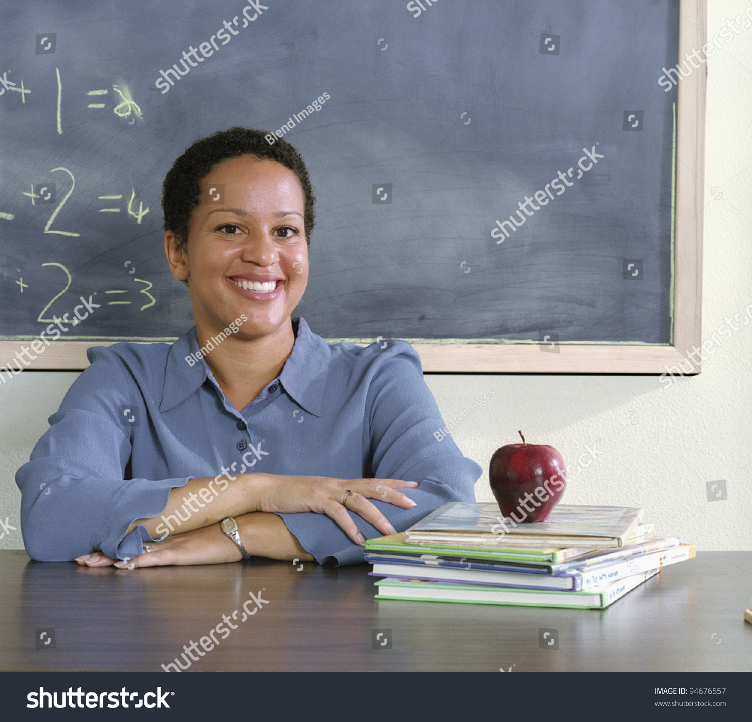 Teacher Sitting At Her Desk Stock Photo 94676557 : Shutterstock