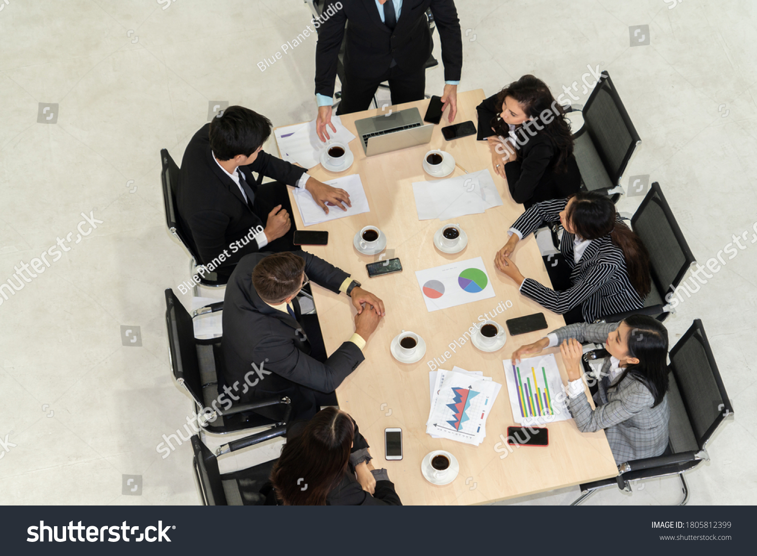 team-leader-encourages-people-team-meeting-stock-photo-1805812399