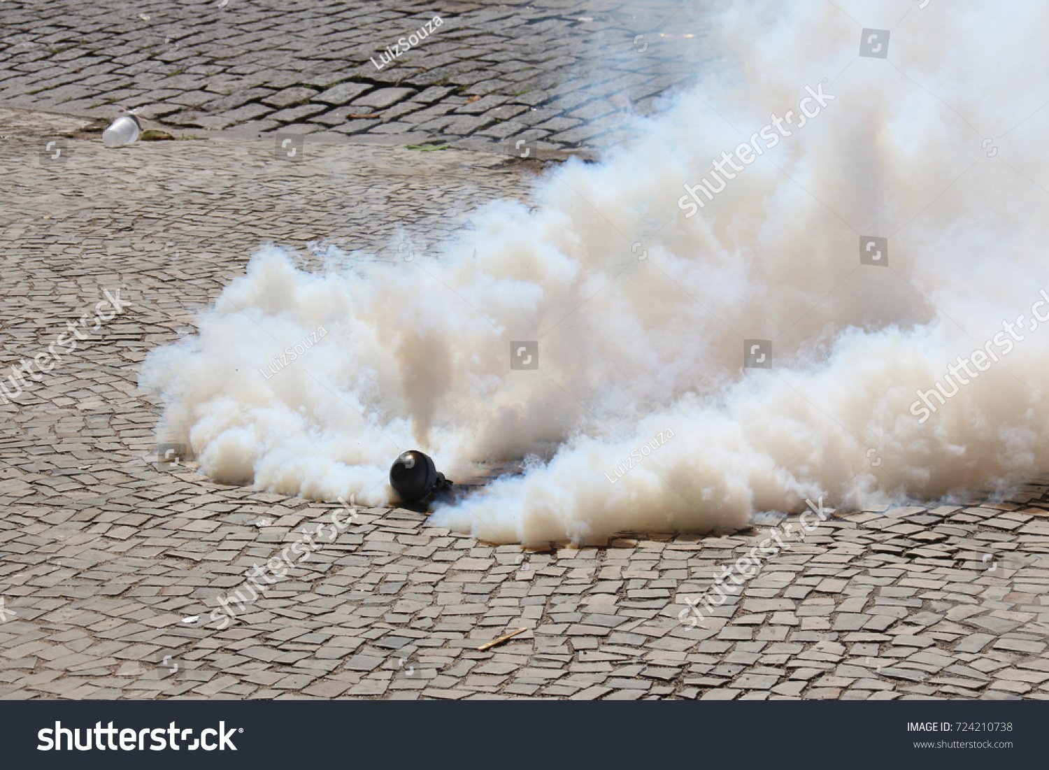 14 220 Tear Gas Stock Photos Images Photography Shutterstock   Stock Photo Tear Gas Bomb Exploding On The Floor 724210738 