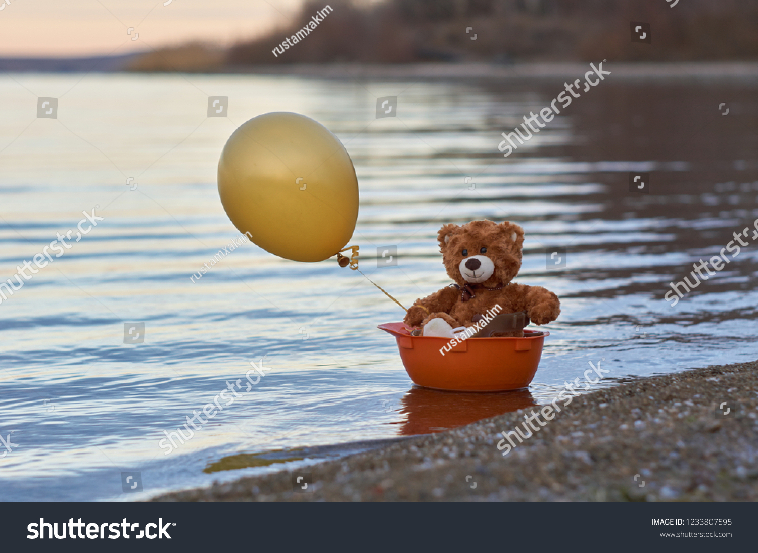 floating teddy bear with balloons