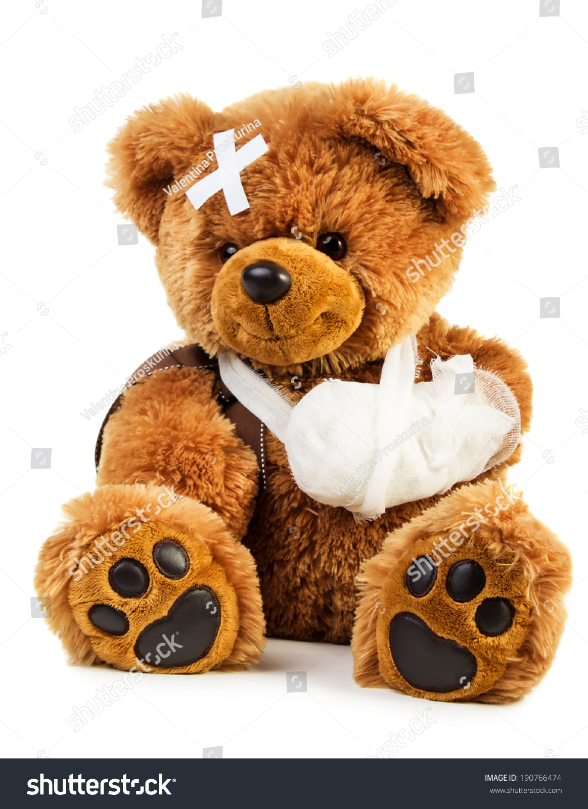 teddy bear with bandage on head