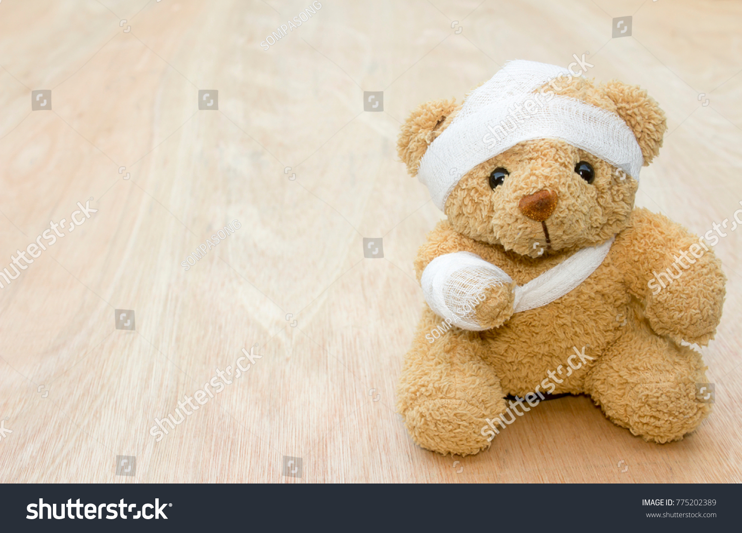 teddy bear with broken arm