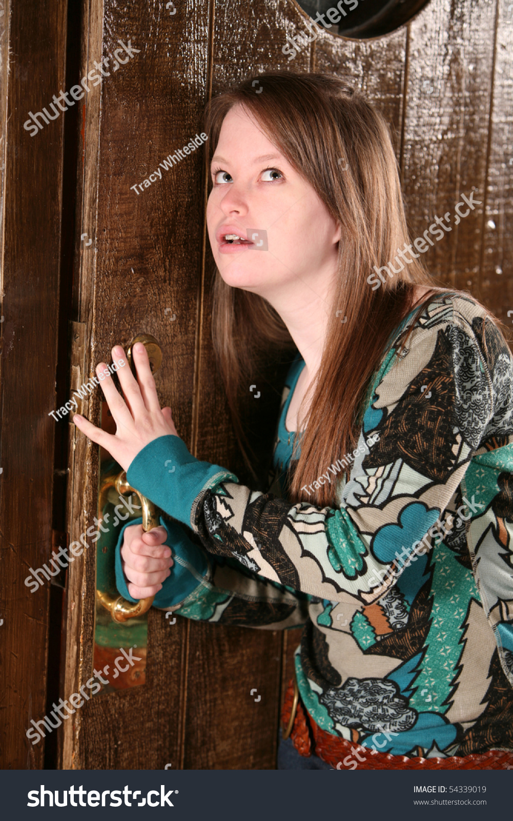 Teen Girl Opening And Listening At Door Stock Photo 54339019 : Shutterstock