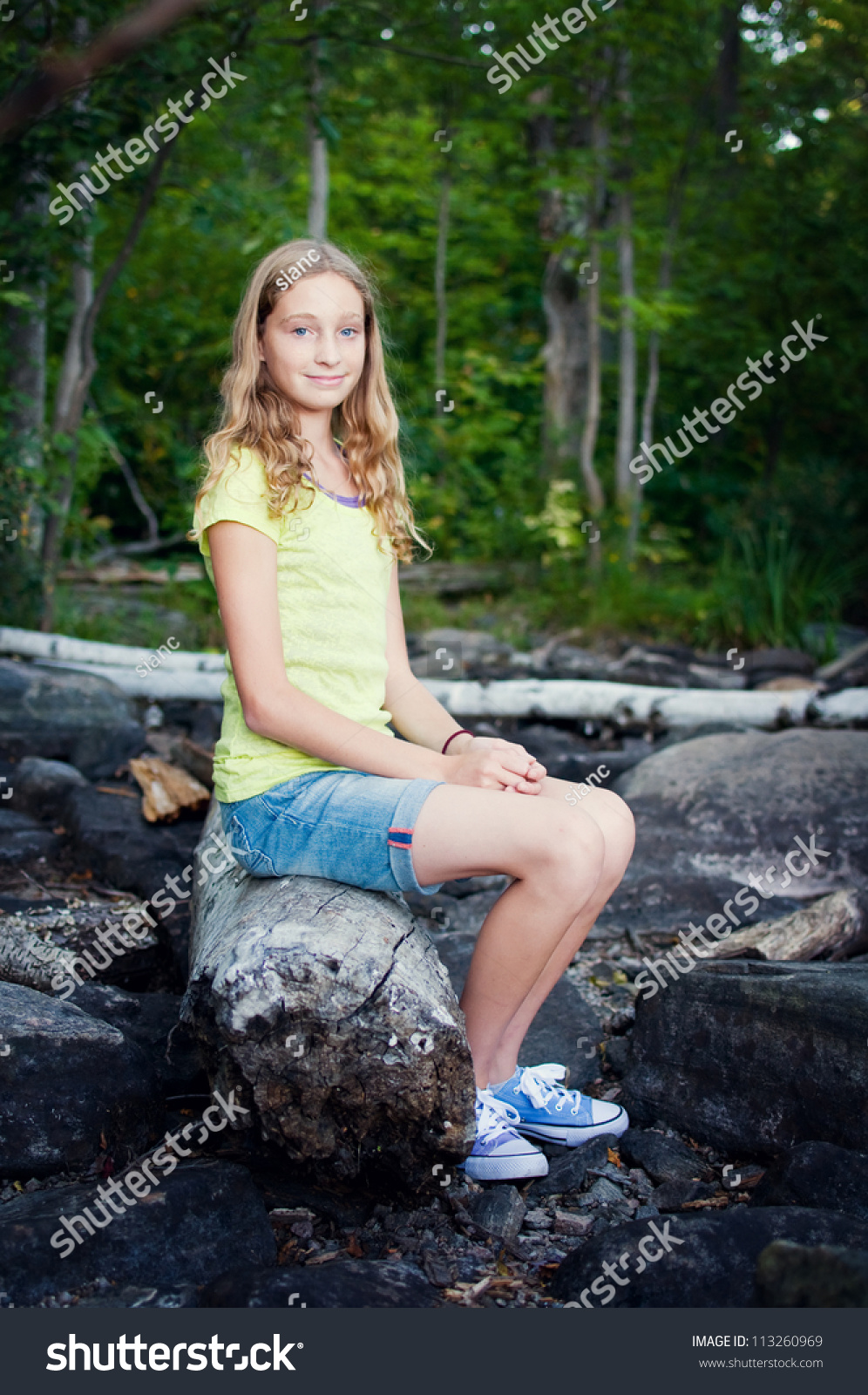 Teen Girl Sitting On Log Stock Photo 113260969 | Shutterstock