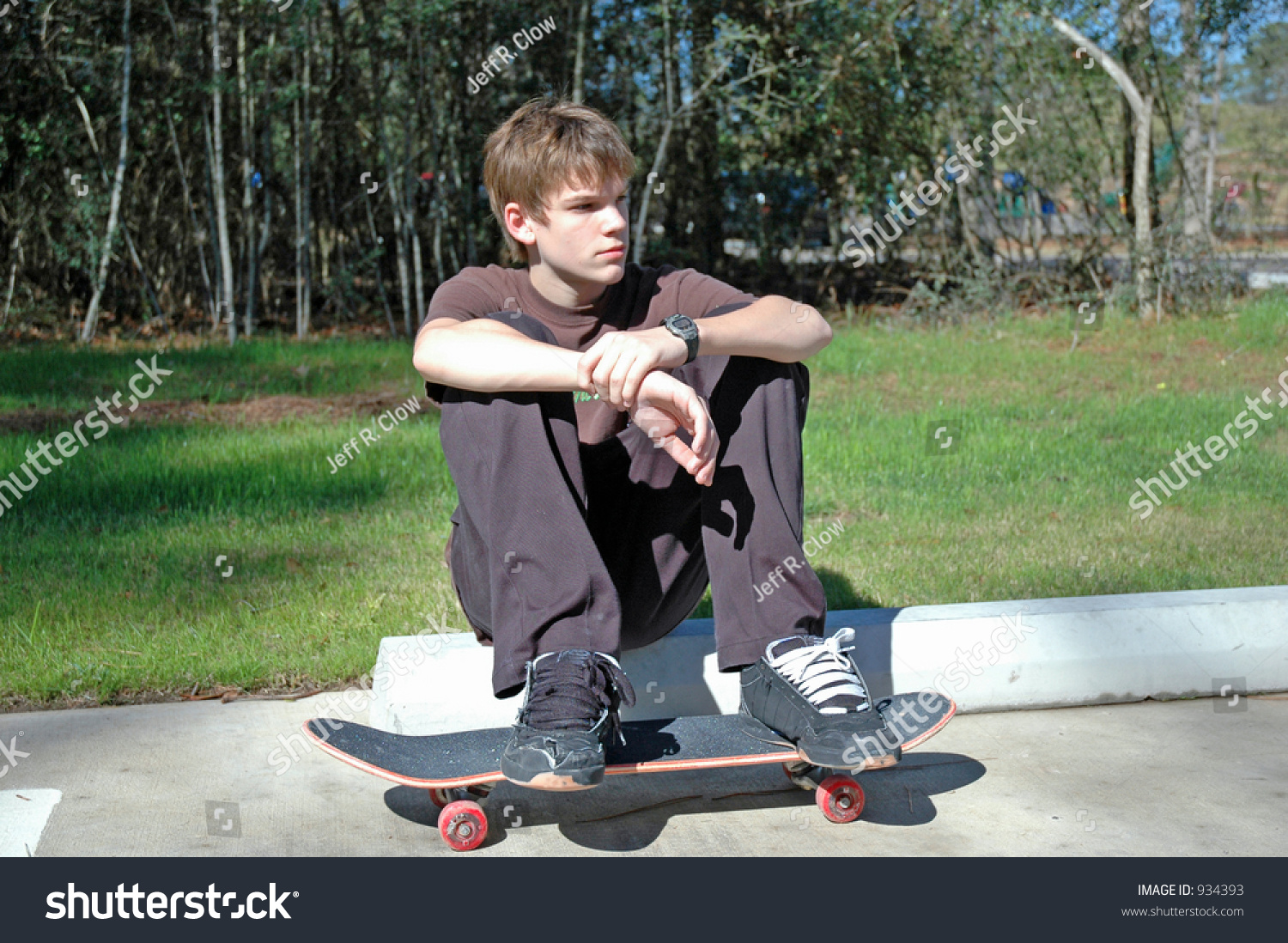 stock-photo-teen-skateboarder-at-rest-934393.jpg