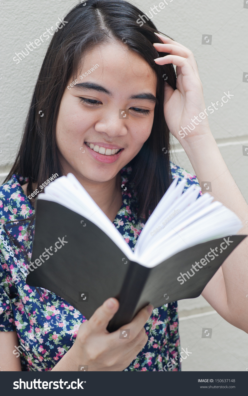 teenage-asian-girl-reading-book-stock-photo-150637148-shutterstock