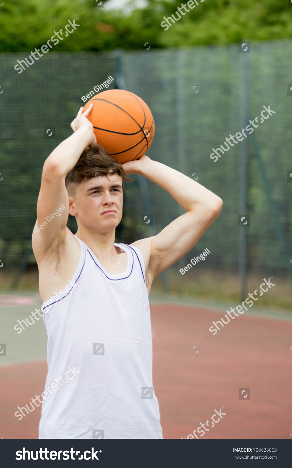 Teenage Boy Shooting Hoop On Basketball Stock Photo 708628063 ...