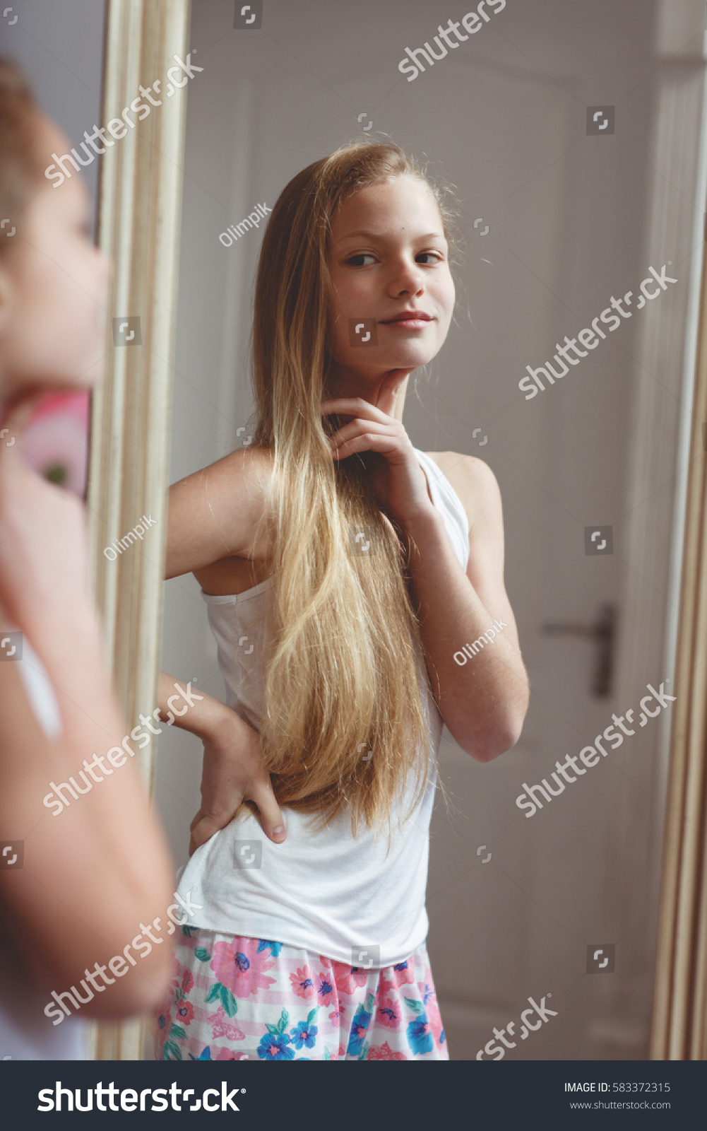 Legal Age Teenager showing her body in a mirror