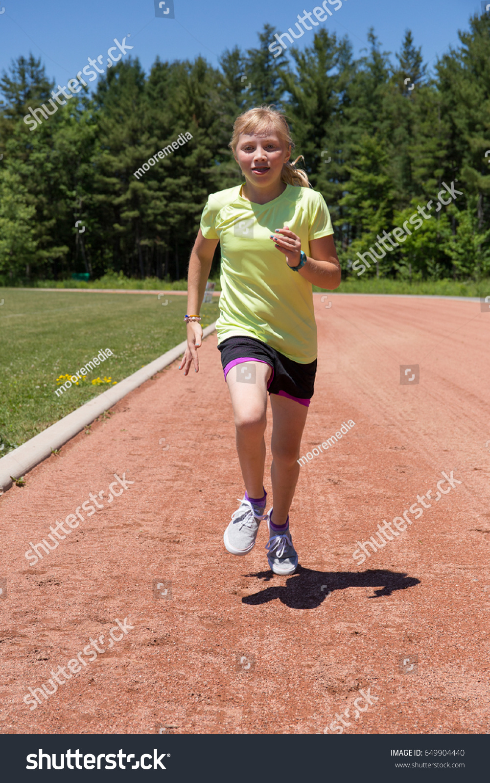 teen in running shorts