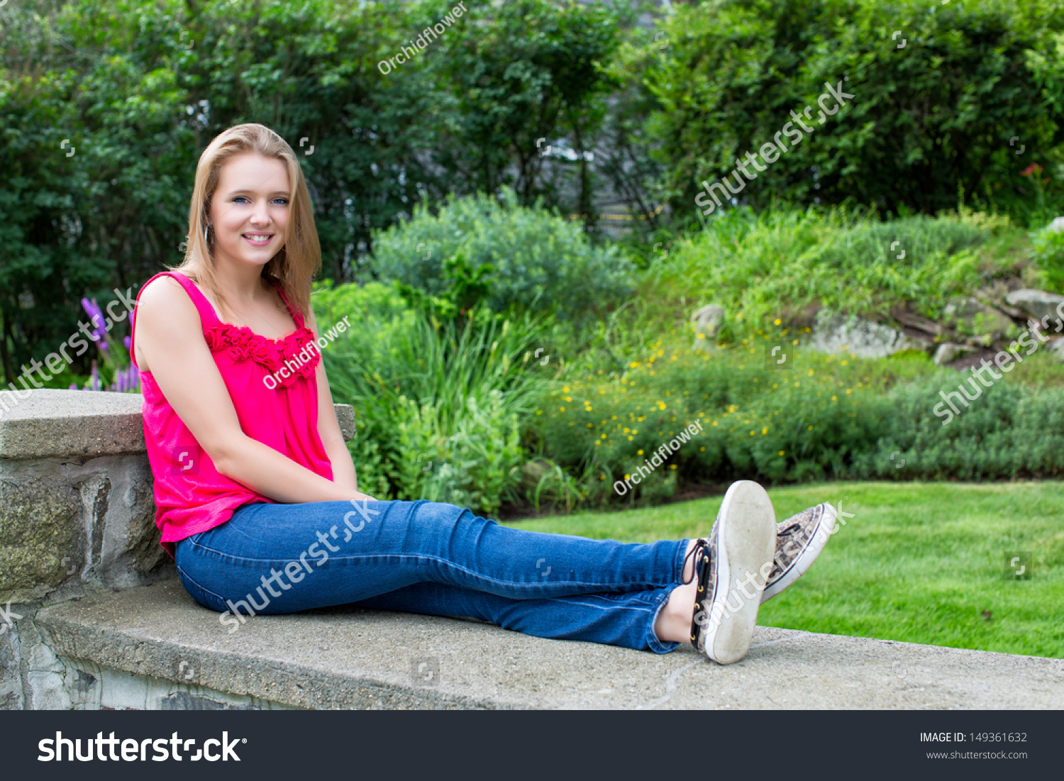 Teenage Girl Sitting On Stone Wall Stock Photo 149361632 : Shutterstock