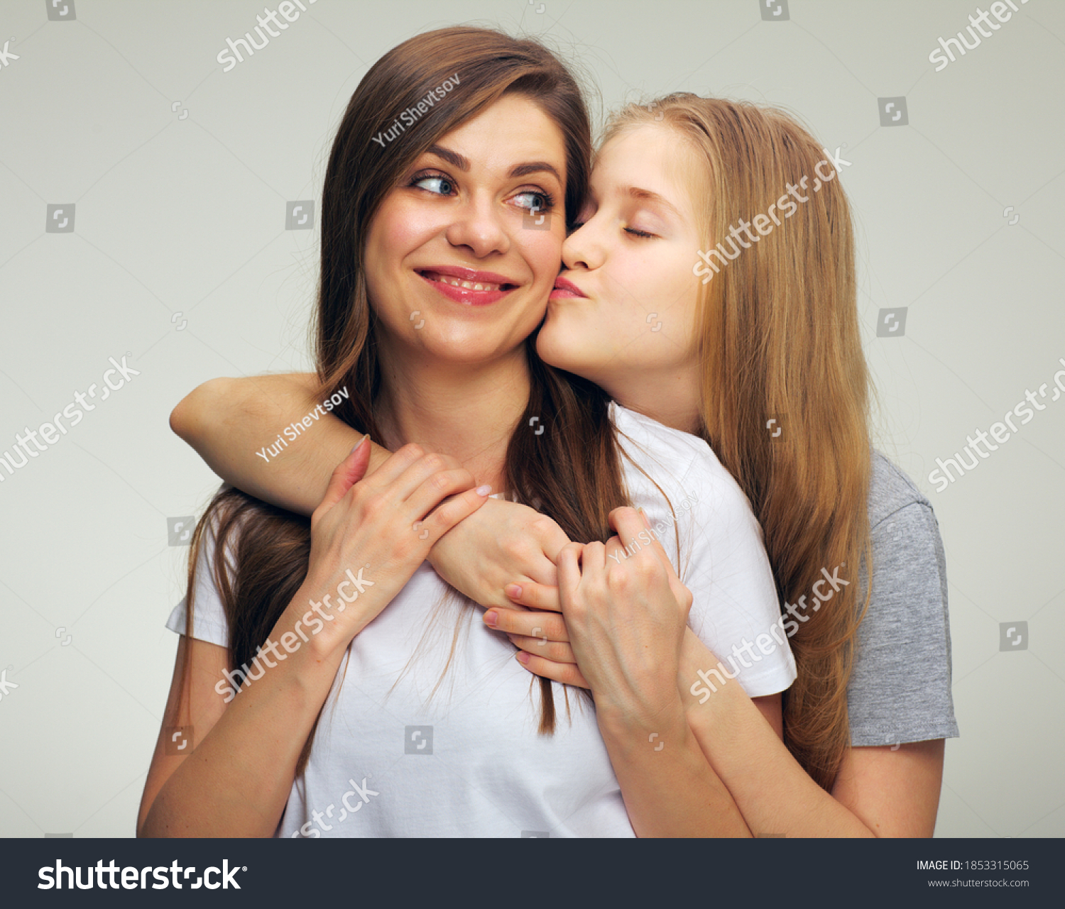 Teenager Girl Kissing Her Mother Portrait Stock Photo (edit Now) 1853315065