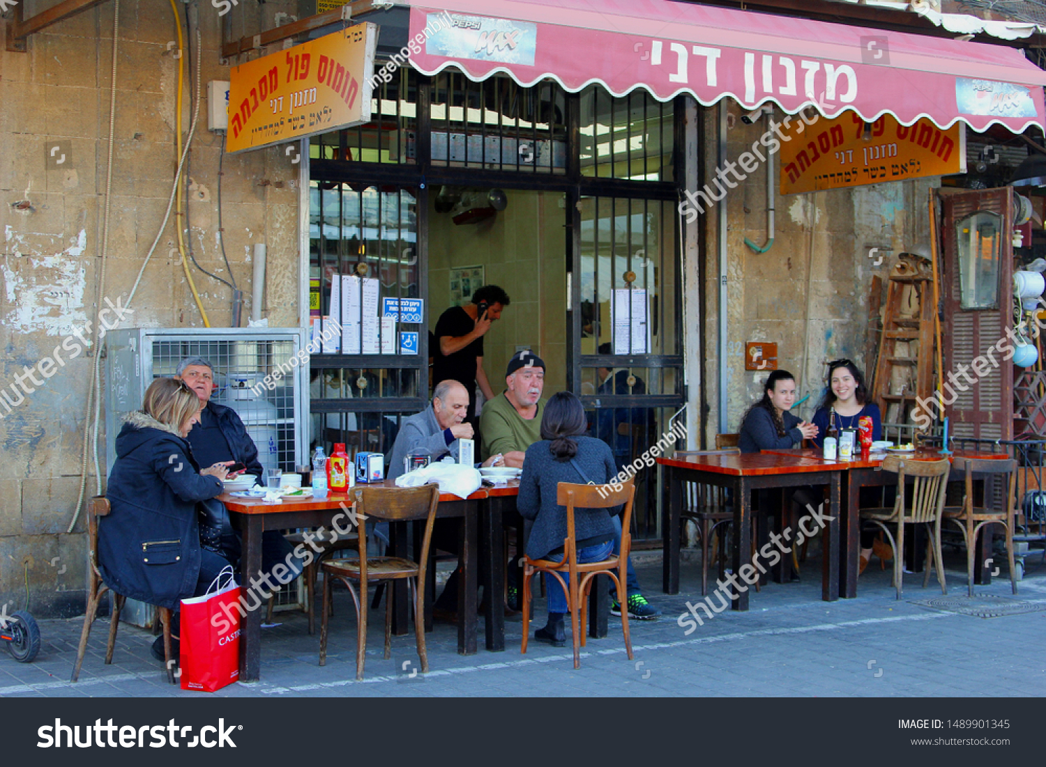 stock-photo-tel-aviv-old-jaffa-israel-february-young-smiling-women-and-elderly-people-eat-and-1489901345.jpg