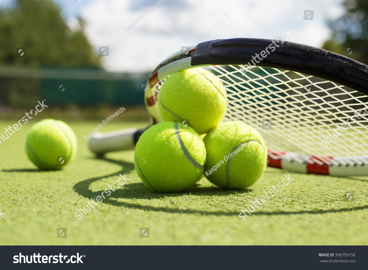 Tennis Balls And Racket On The Grass Court Stock Photo 308750156 ...