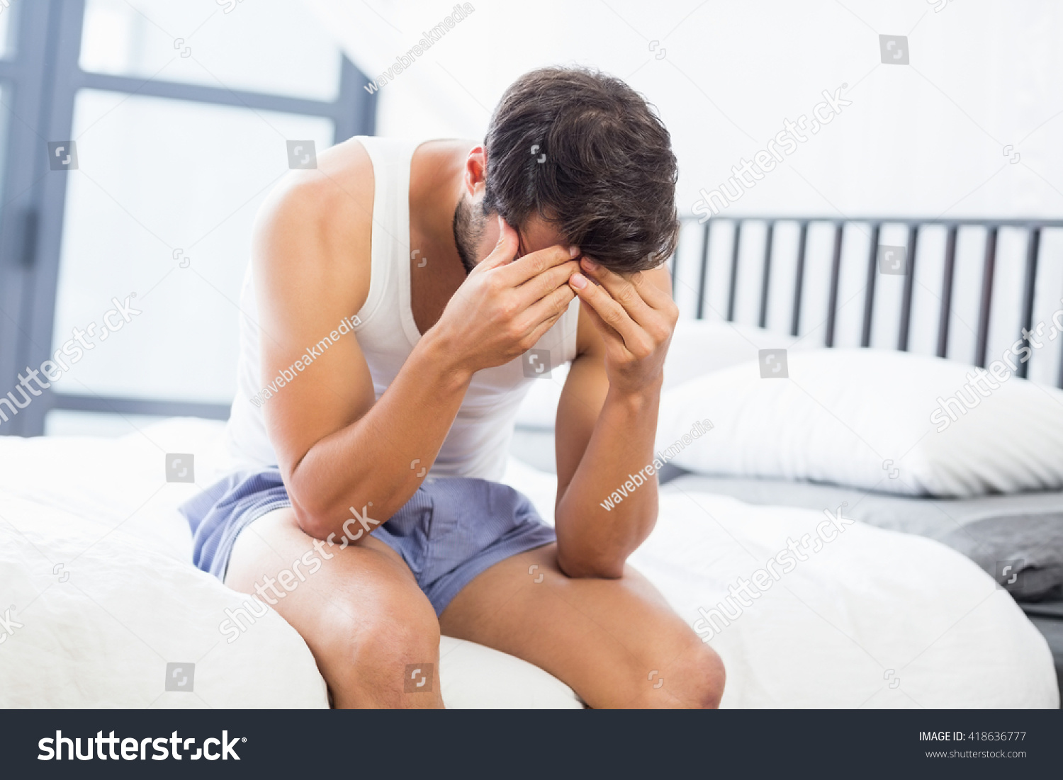 Tensed Young Man Sitting On Bed Foto Stock 418636777 Shutterstock 