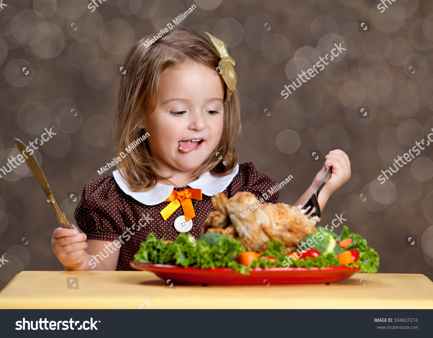 Thanksgiving Dinner. Adorable Little Girl Sitting At A Small Table With ...