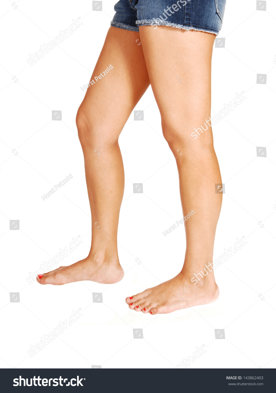 The Beautiful Sexy Legs Of A Young Woman Standing For White Background ...