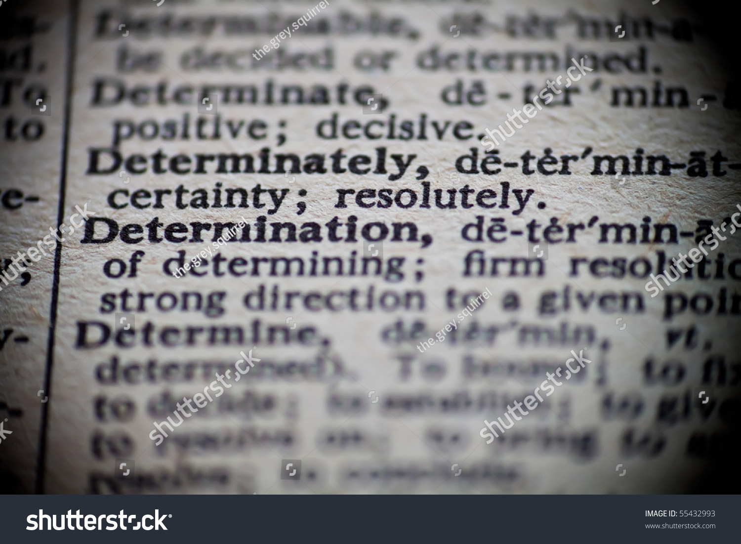 definition-determination-focused-upon-old-dictionary-stock-photo