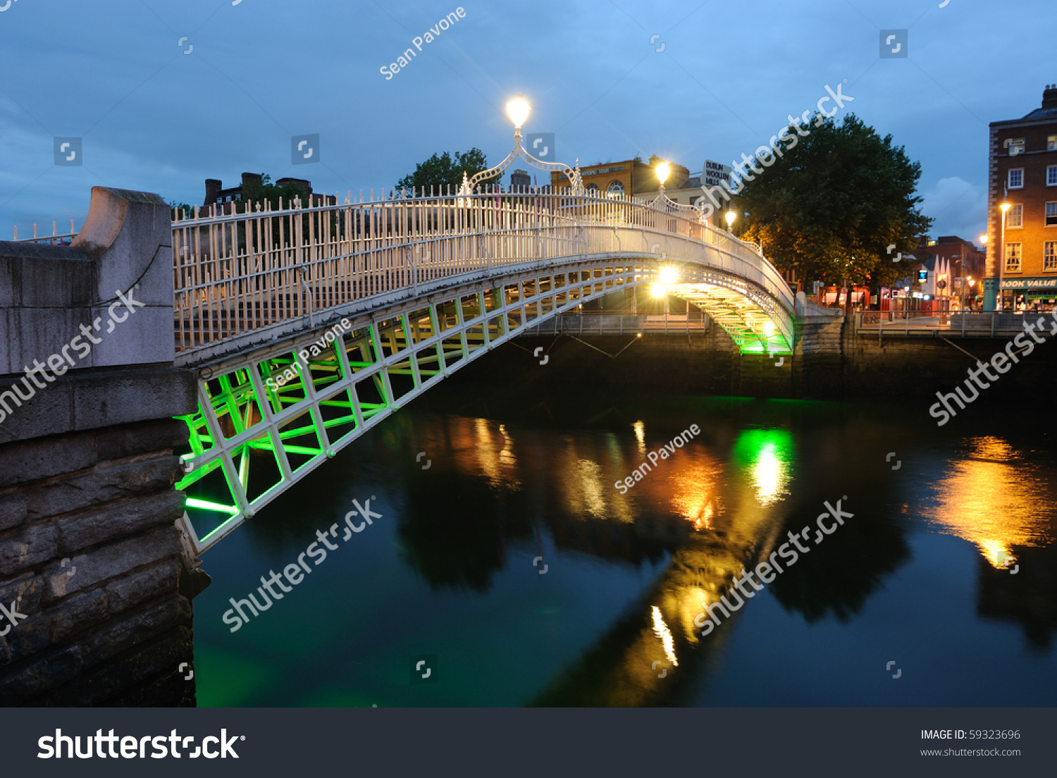 The Ha'Penny Bridge Over The River Liffey In Dublin, Ireland. Stock ...