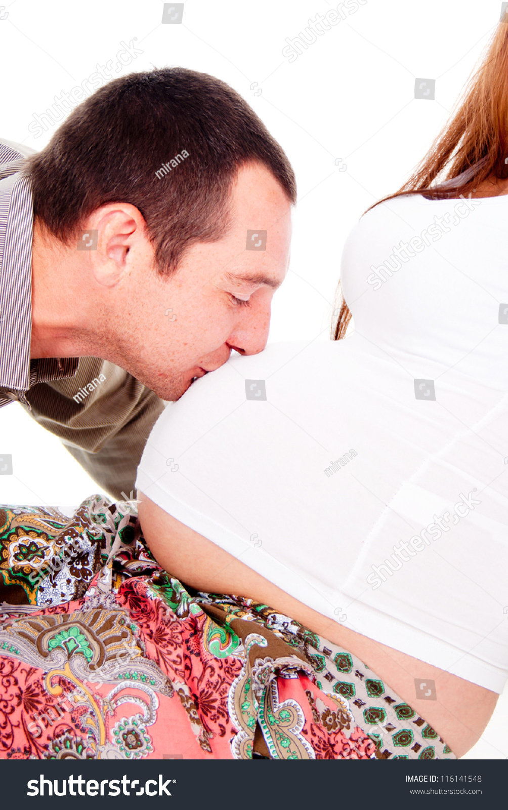 The Husband Kisses The Pregnant Wife Of The Stomach Isolated On White ...