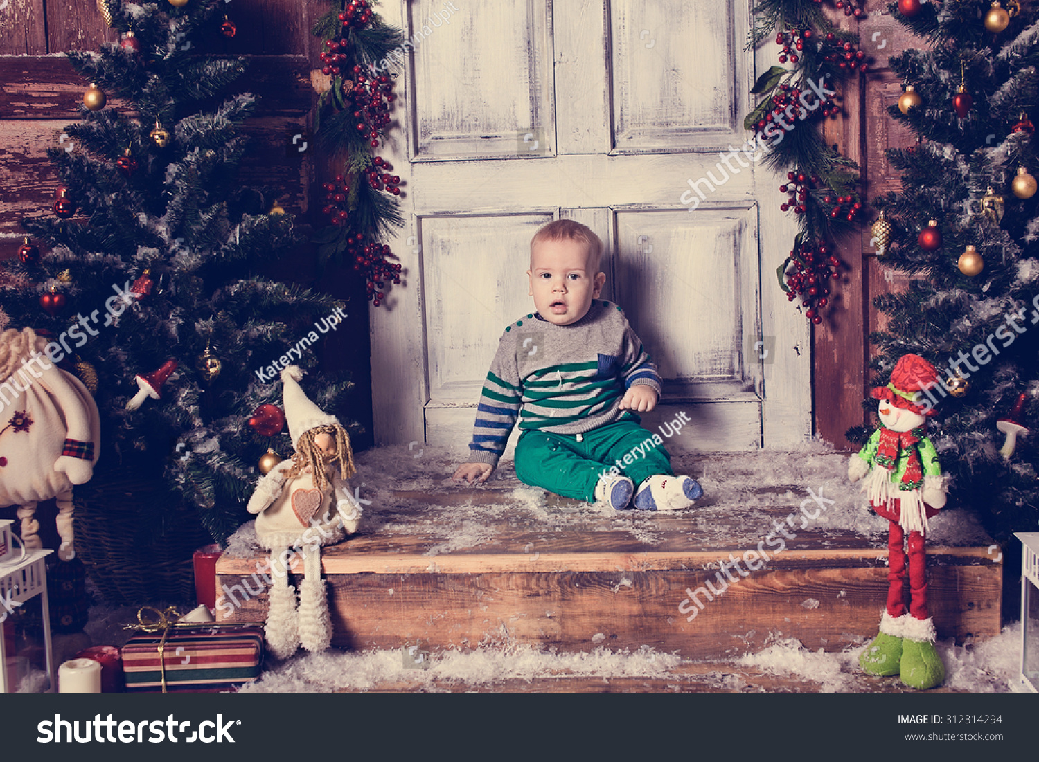 The Kid In The Studio With Christmas Decorations Stock Photo 312314294