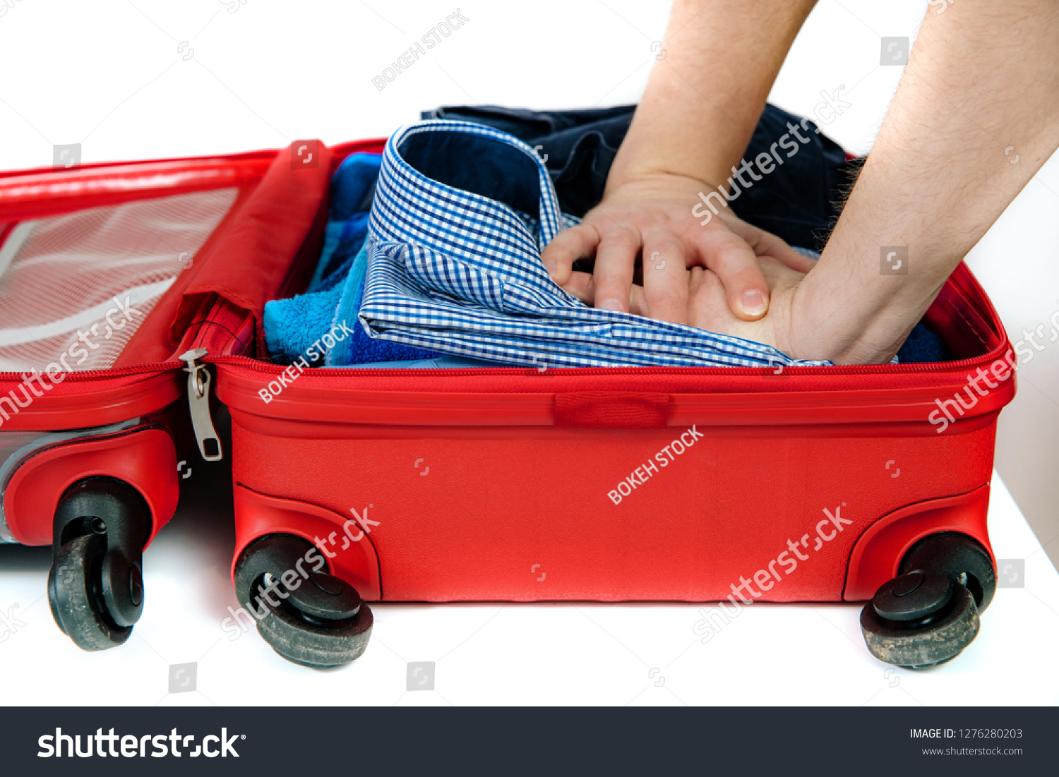 how to put clothes in a suitcase