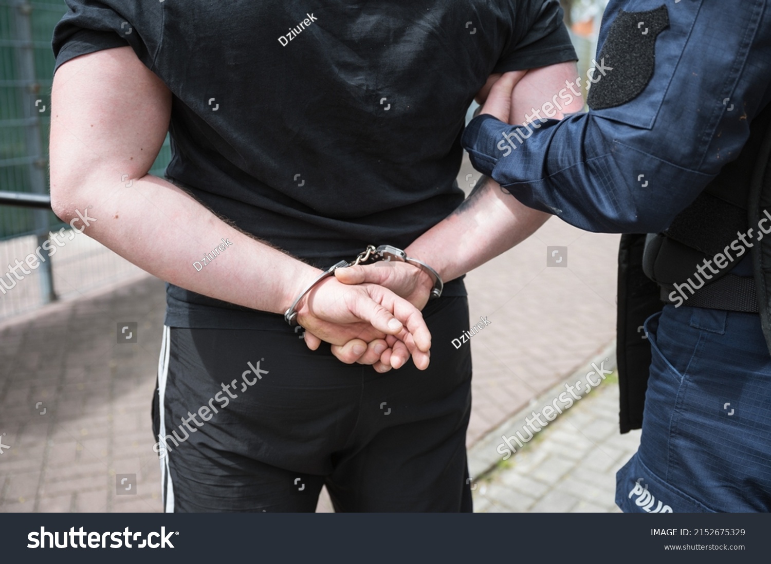 Policeman Holds Detained Man Handcuffs Stock Photo 2152675329 ...