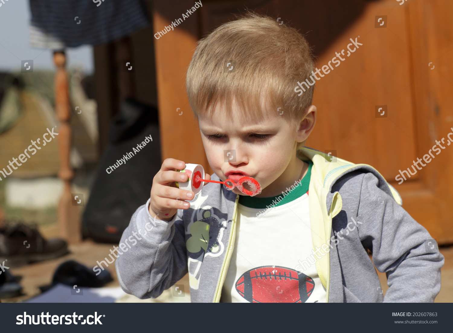 Serious Boy Blowing Soap Bubble Outdoor Stock Photo 202607863 ...