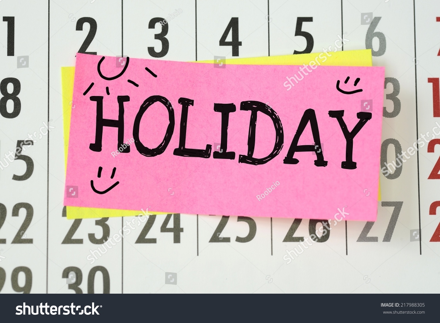 The Word Holiday Written On Sticky Note Paper Stuck To A Wall Calendar ...