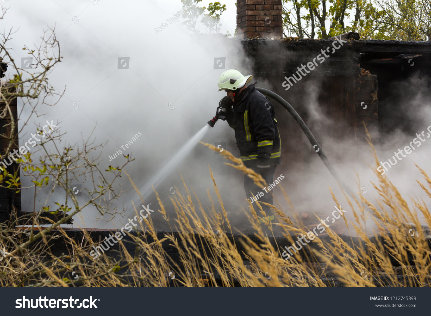 Work Firefighters Extinguishing Fire Destroyed Village Stock Photo ...