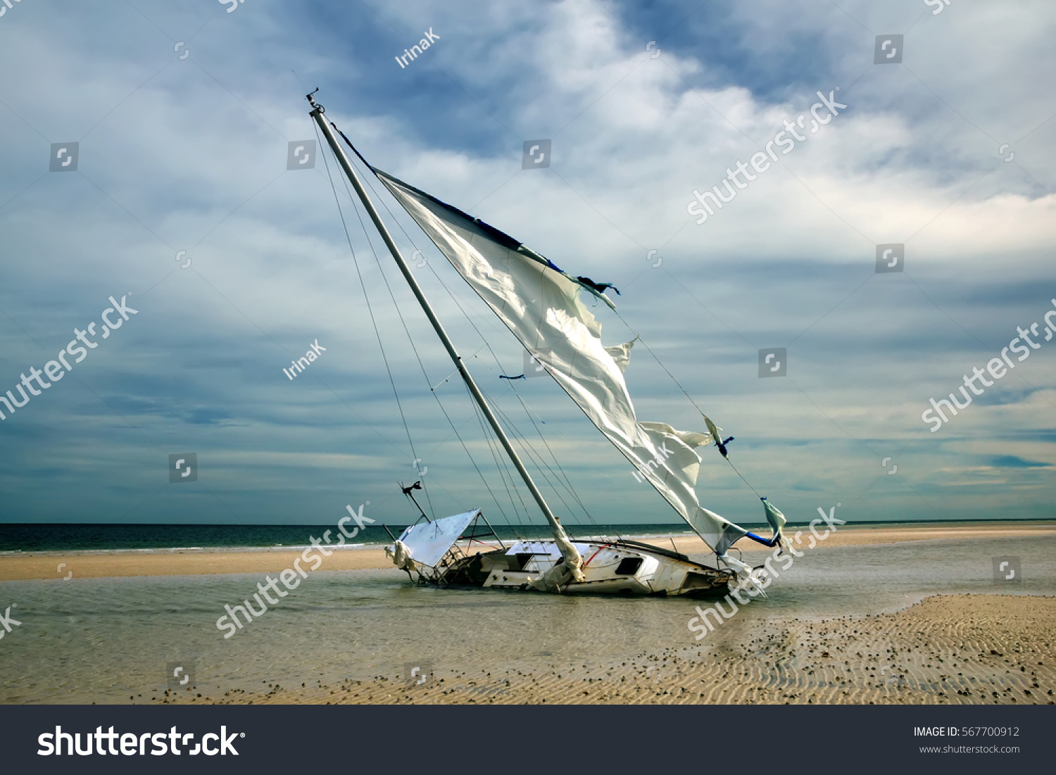 sailboat with torn sails