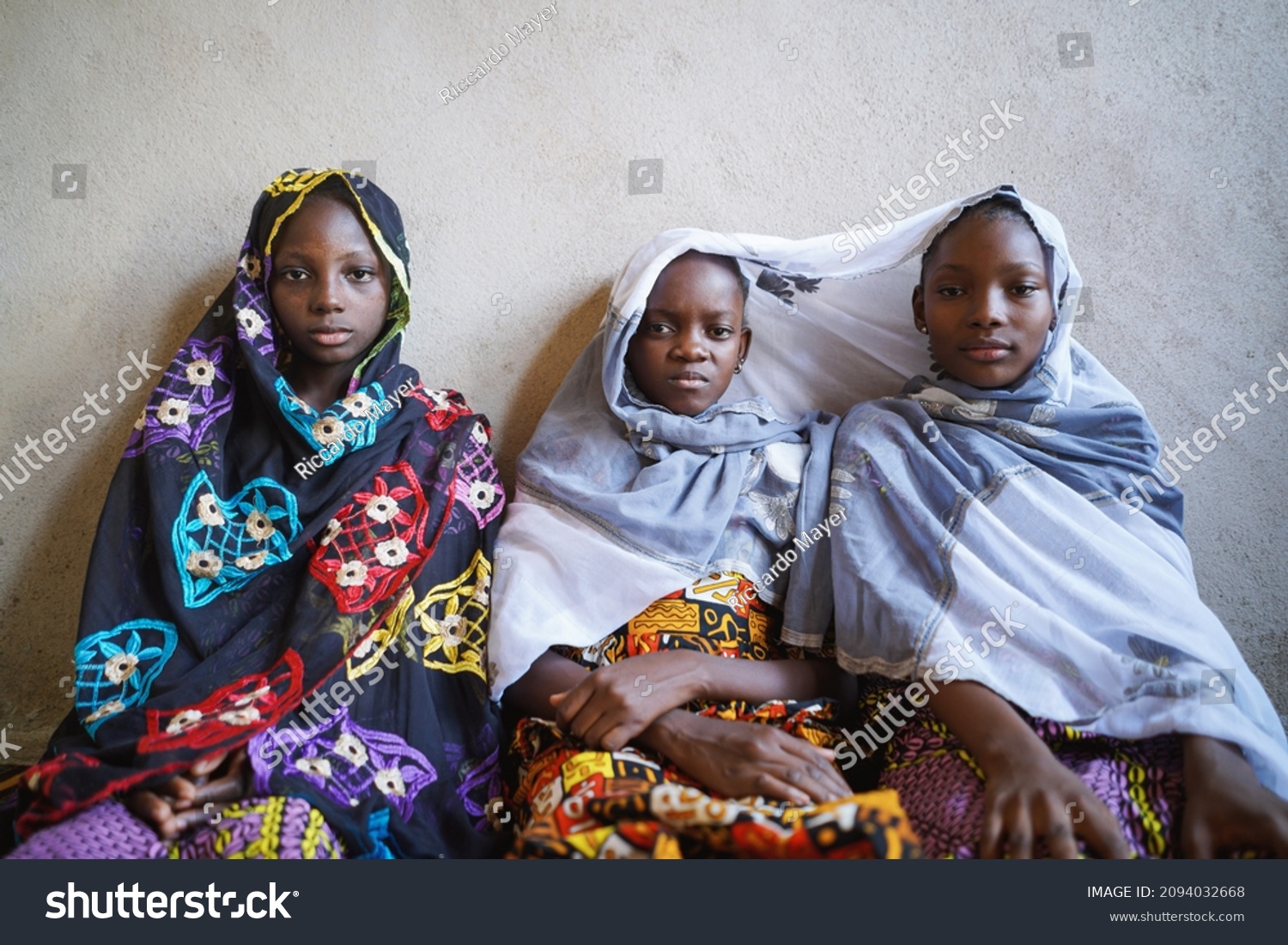 Three African Girls Sit Together Pose Stock Photo (Edit Now) 2094032668