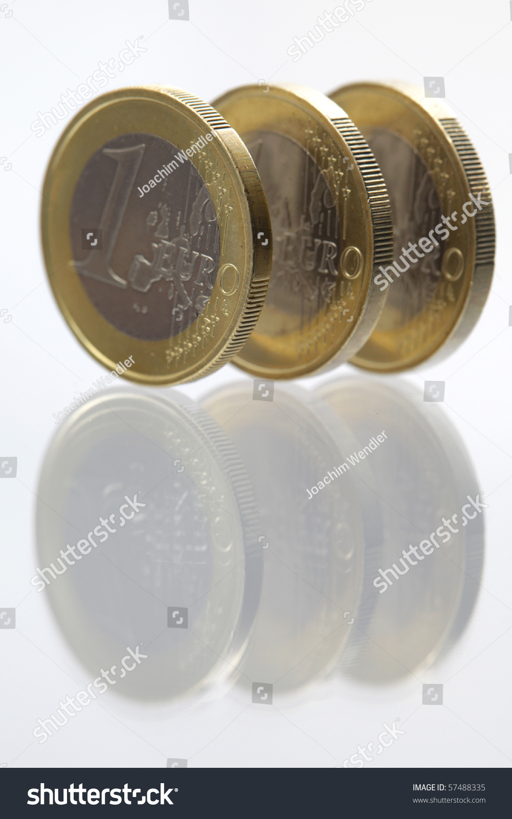 stock-photo-three-euro-coins-with-reflec