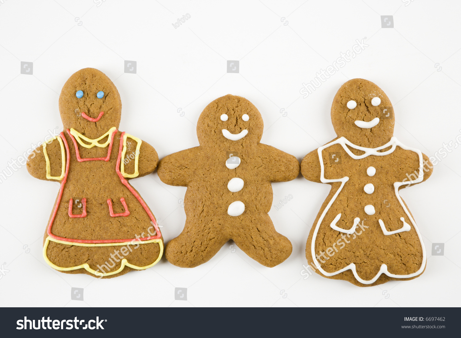 Three Male And Female Gingerbread Cookies Holding Hands. Stock Photo ...