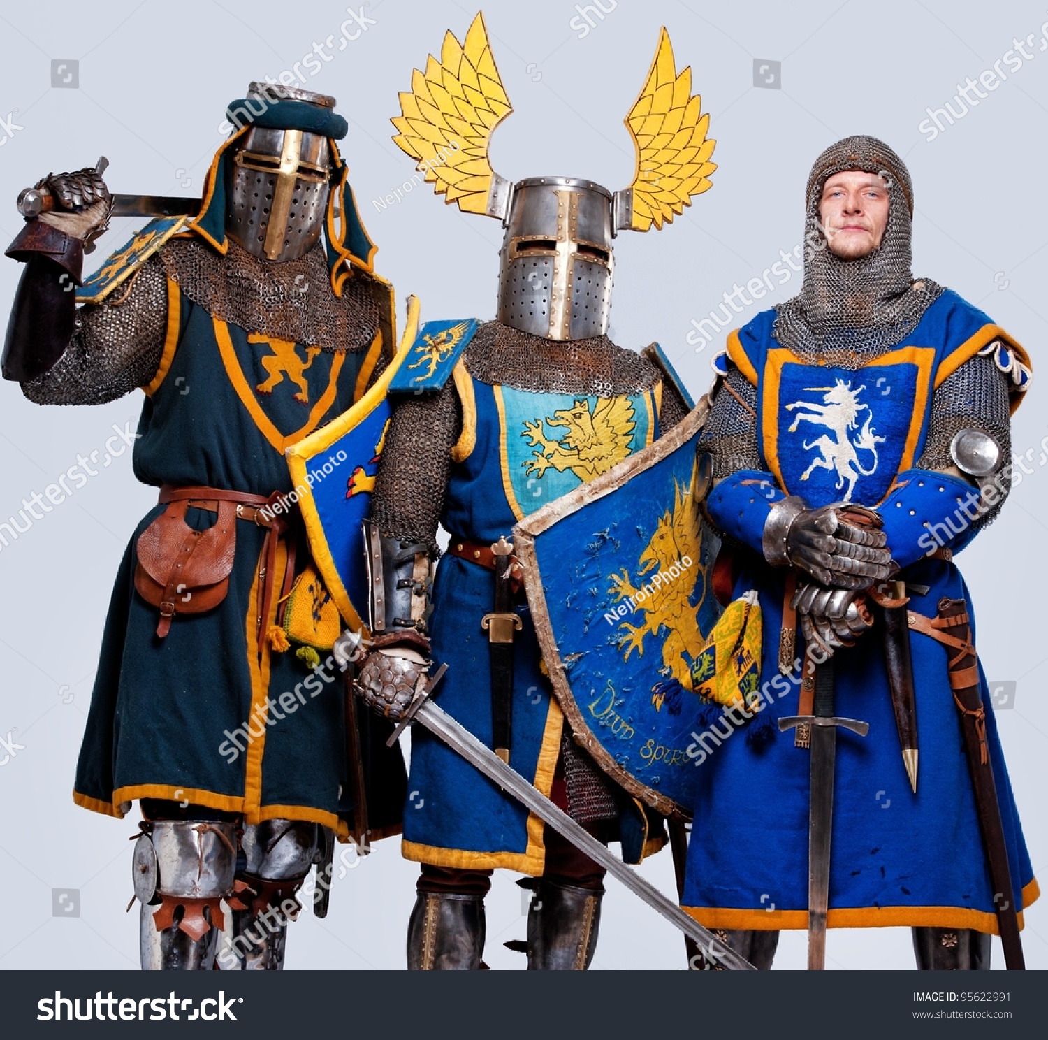 Three Medieval Knights Isolated On Grey Background. Stock Photo ...