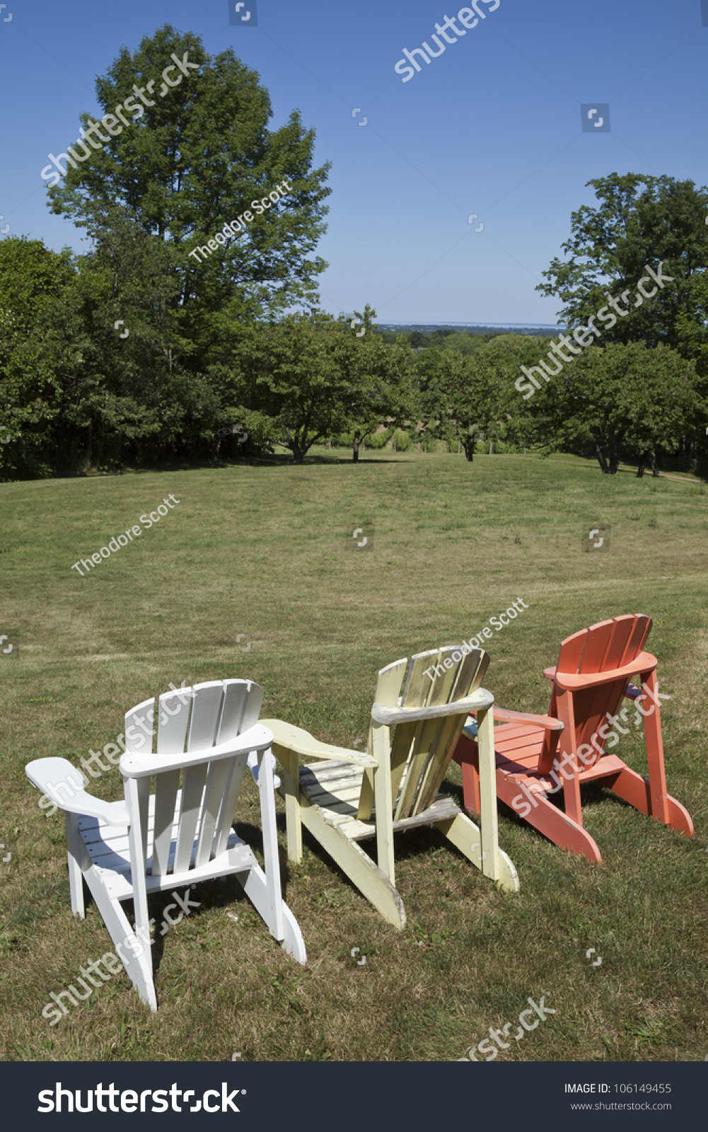 Three Muskoka Chairs Next To Each Other Facing The Scenery. Stock Photo ...