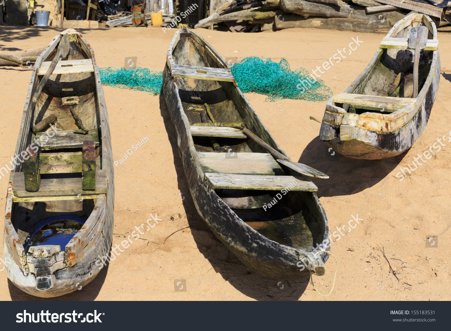 Three Old Dugout Canoes On The Beach With Nets In Axim, Ghana Stock ...