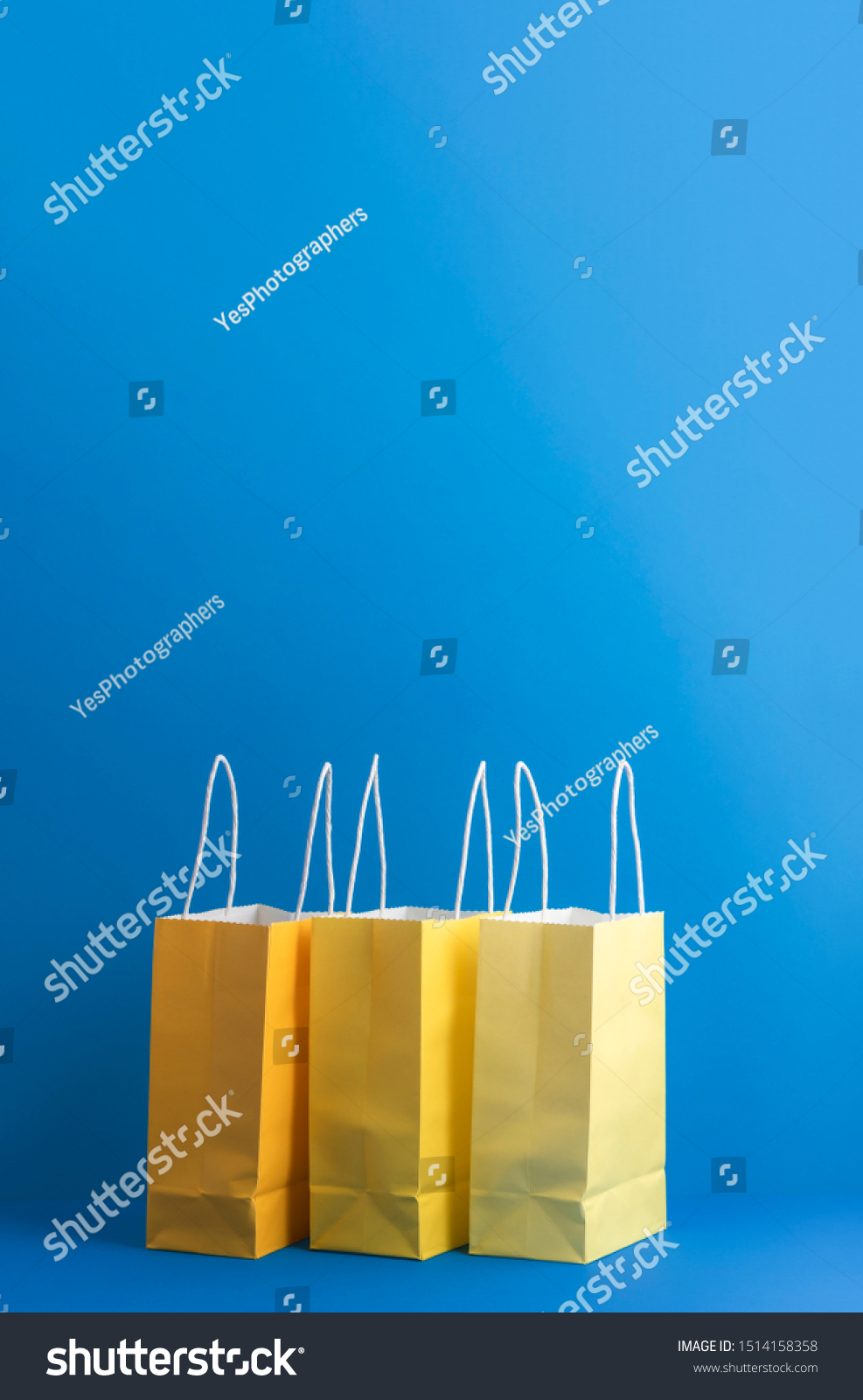 Download Three Yellow Paper Bags On Blue Business Finance Stock Image 1514158358 Yellowimages Mockups