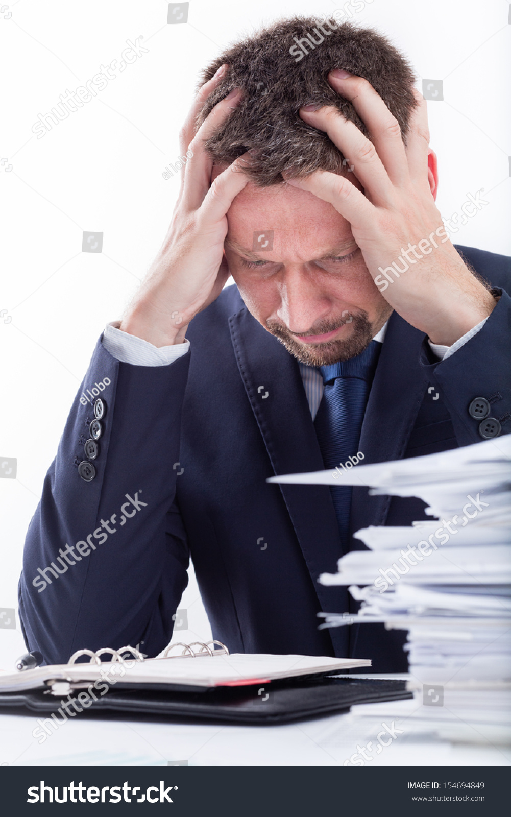 Too Much Work. Portrait Of Exhausted Businessman Sitting At Office Desk ...