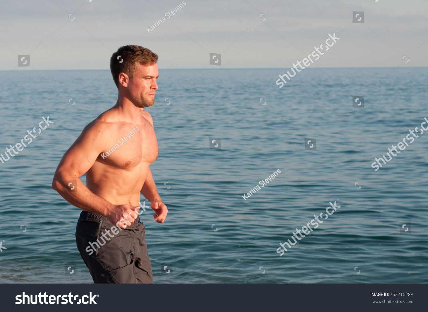 Topless Man Barefoot Running On Beach Stock Photo Shutterstock