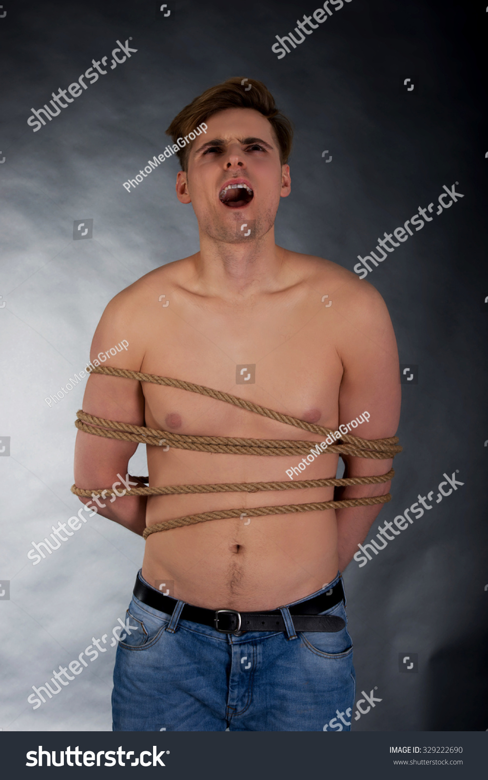 Tortured Shirtless Man Tied Rope Foto Stok 329222690 Shutterstock